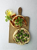 Pizza margherita and pizza broccoli and salsiccia