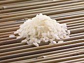 Sushi rice on bamboo sticks