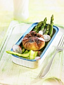 Fried egg with beetroot on asparagus and radishes (Spain)
