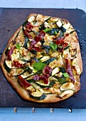 Pizza with courgette, Serano ham and mint