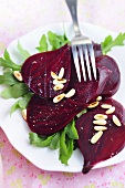 Beetroot carpaccio on rocket with pine nuts