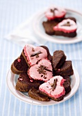 Heart-shaped brownies with pink icing