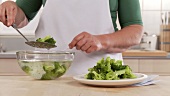 Blanching broccoli: removing the vegetables from the iced water