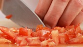 Tomatoes being diced