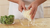 Parmesan being grated