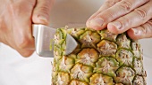 Pineapple being peeled and chopped (German Voice Over)