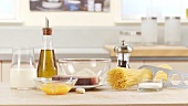 Ingredients for spaghetti carbonara: cream, egg yolk, bacon and spaghetti