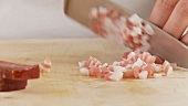 Bacon being diced