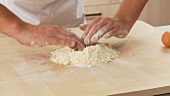 A well being made in a flour-butter mixture