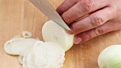 Onions being cut into fine rings
