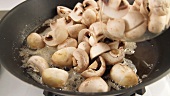 Mushrooms being fried in hot butter
