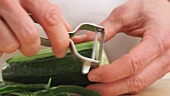 Sushi Chef Peeling a Cucumber