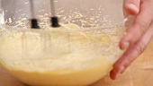 Dough being made with a hand mixer