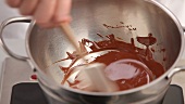 Chocolate being melted and stirred