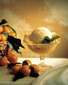 Orange Sherbet in Pedestal Cup; Kumquats and Mint Leaves