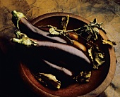 Whole Purple Eggplants in Wooden Bowl