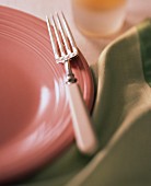 Mauve Plate with Green Napkin and Bone Handled Fork