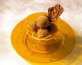 Chocolate Ice Cream with Lemon Peels and a Wafer in a Yelow Bowl