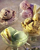 Four Different Ice Creams in Glass Bowls