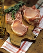 Pork Chops with Rosemary on Pig Cutting Board