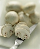 Sliced White Button Mushrooms; Knife