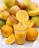 A Fresh Glass of Orange Juice with Assorted Fruit
