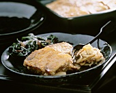 Potato Gratin on a Plate with Salad