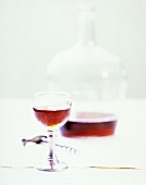 Red Wine in Glass; Decanter and Corkscrew