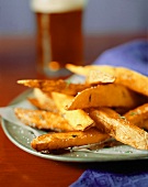 Herbed Steak Fries on a Plate; Salt