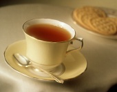 A Cup of Tea with Saucer and Spoon