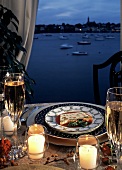 Seafood Terrine on a Table; Harbor in the Background