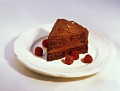 A Slice of Chocolate Cake with Raspberries