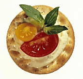 Cracker with Cheese Spread and Tomato