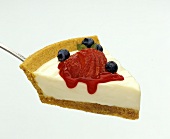 Cheesecake Slice on Spatula with Fresh Berries