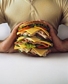 A Man Holding a Giant Sandwich