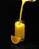 Orange Juice Pouring into a Glass