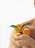Tangerines on a Man's Shoulder