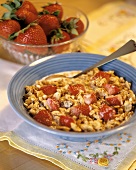 A Bowl of Granola with Fresh Strawberries