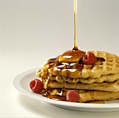 Pouring Maple Syrup onto Waffles