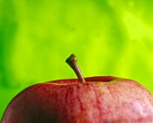 The Top of a Red Apple; Green Background