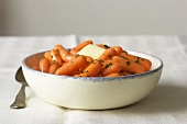 A Side View of Bowl of Cooked Baby Carrots
