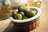 Pickled green olives in a small bowl