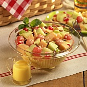 Fruit salad with nuts; orange juice