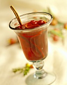 Punch with cranberries and cinnamon stick