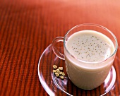 Instant coffee with milk in a glass cup