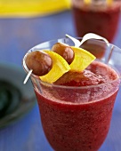 A sangria smoothie with fresh fruit