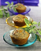 Corn muffins with pine nuts on coloured plates