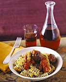 Fusilli with meatballs and tomatoes; red wine