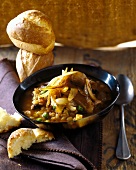 Hearty lentil stew with peas and fried onions