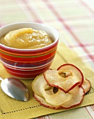 A Bowl of Applesauce with Dried Apple Slices